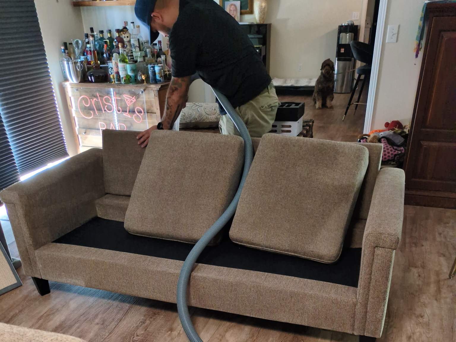 Raindrop Cleaning technician cleaning a fabric sofa in a Yakima home